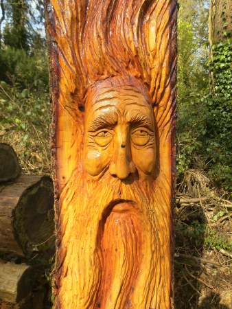 Orange Carved face in Wood - Public Domain Photograph