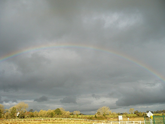 Rainbow in grey sky - Public Domain Photograph